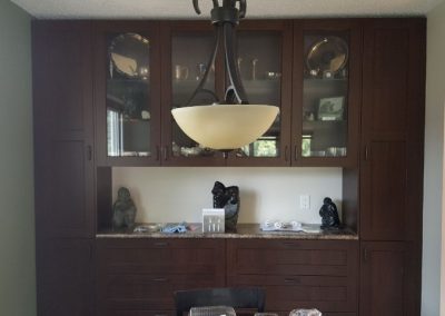 dark cabinets with glass paneling