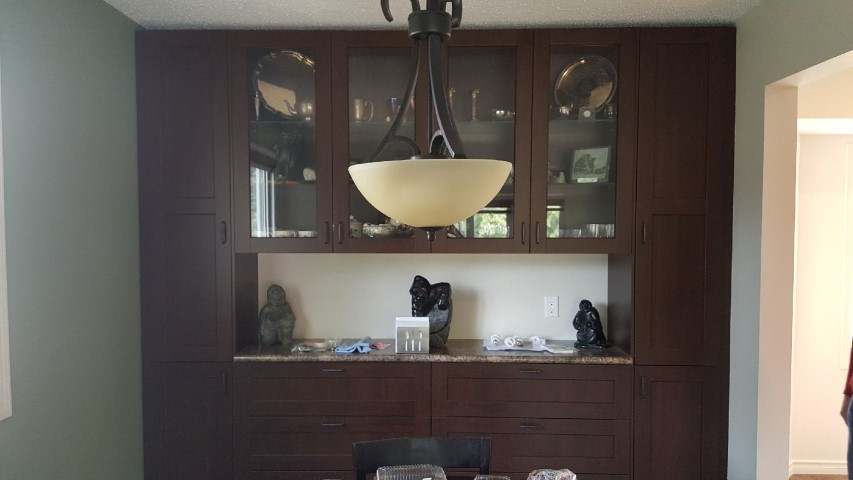 dark cabinets with glass paneling